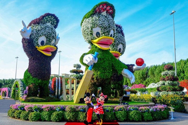 Explore a whimsical world filled with stunning floral sculptures and lively scenes where creativity blossoms amid charming backdrops perfect for memorable photo opportunities in Dubai's Miracle Garden.